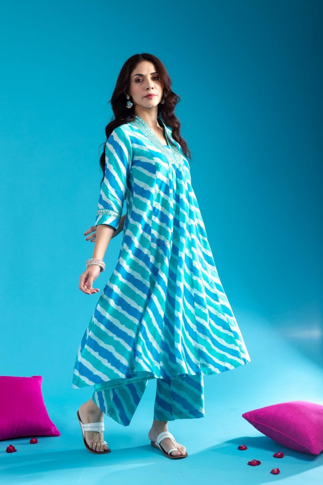 Blue Cotton Anarkali Kurta Pant Set With Neck Embroidery For WomenMaterial composition : 100% CottonLength : Knee LengthSleeve type : 3/4 SleeveMaterial type : CottonOccasion : Casual ,Office wear ,Party ,Wedding , Ragular &amp; FeBlue Cotton Anarkali Kurta Pant Set