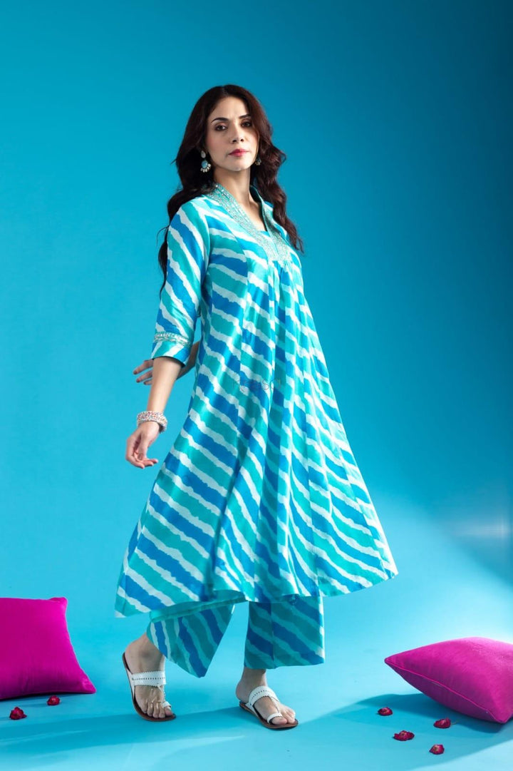 Blue Cotton Anarkali Kurta Pant Set With Neck Embroidery For WomenMaterial composition : 100% CottonLength : Knee LengthSleeve type : 3/4 SleeveMaterial type : CottonOccasion : Casual ,Office wear ,Party ,Wedding , Ragular &amp; FeBlue Cotton Anarkali Kurta Pant Set