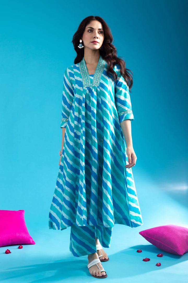Blue Cotton Anarkali Kurta Pant Set With Neck Embroidery For WomenMaterial composition : 100% CottonLength : Knee LengthSleeve type : 3/4 SleeveMaterial type : CottonOccasion : Casual ,Office wear ,Party ,Wedding , Ragular &amp; FeBlue Cotton Anarkali Kurta Pant Set