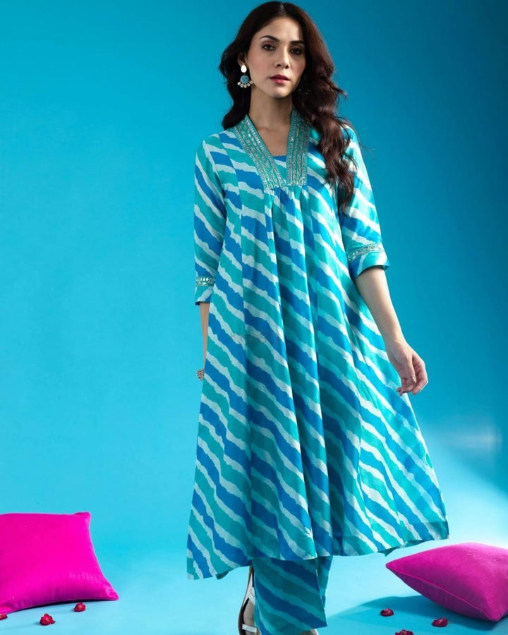 Blue Cotton Anarkali Kurta Pant Set With Neck Embroidery For WomenMaterial composition : 100% CottonLength : Knee LengthSleeve type : 3/4 SleeveMaterial type : CottonOccasion : Casual ,Office wear ,Party ,Wedding , Ragular &amp; FeBlue Cotton Anarkali Kurta Pant Set